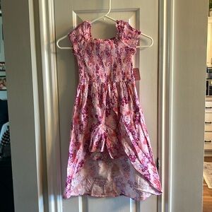 One piece short set with long skirt in the back.